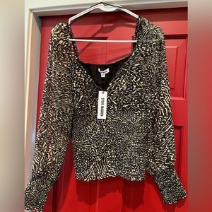 Steve Madden V-neck rouged blouse.